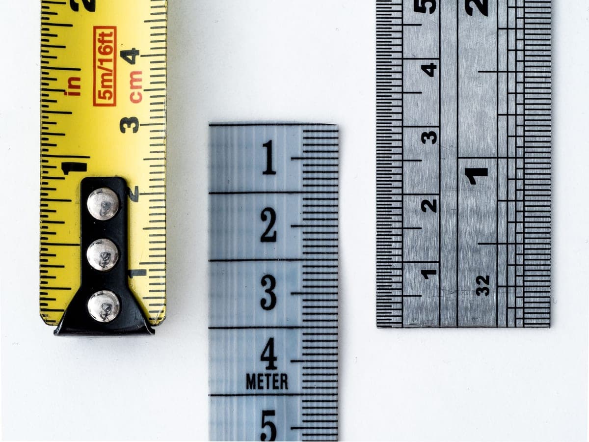 A steel rule laid across a workbench for measuring