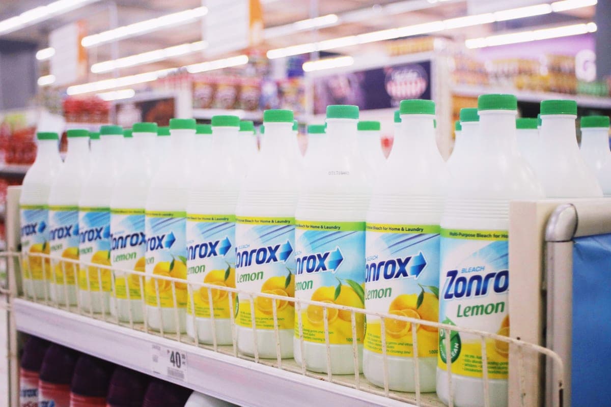Household cleaning bottles standing on a shelf