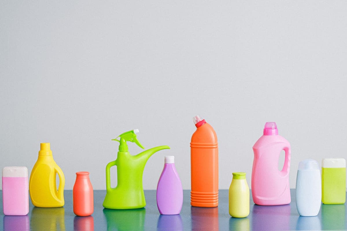 Chemical bottles and measuring equipment arranged on a work surface