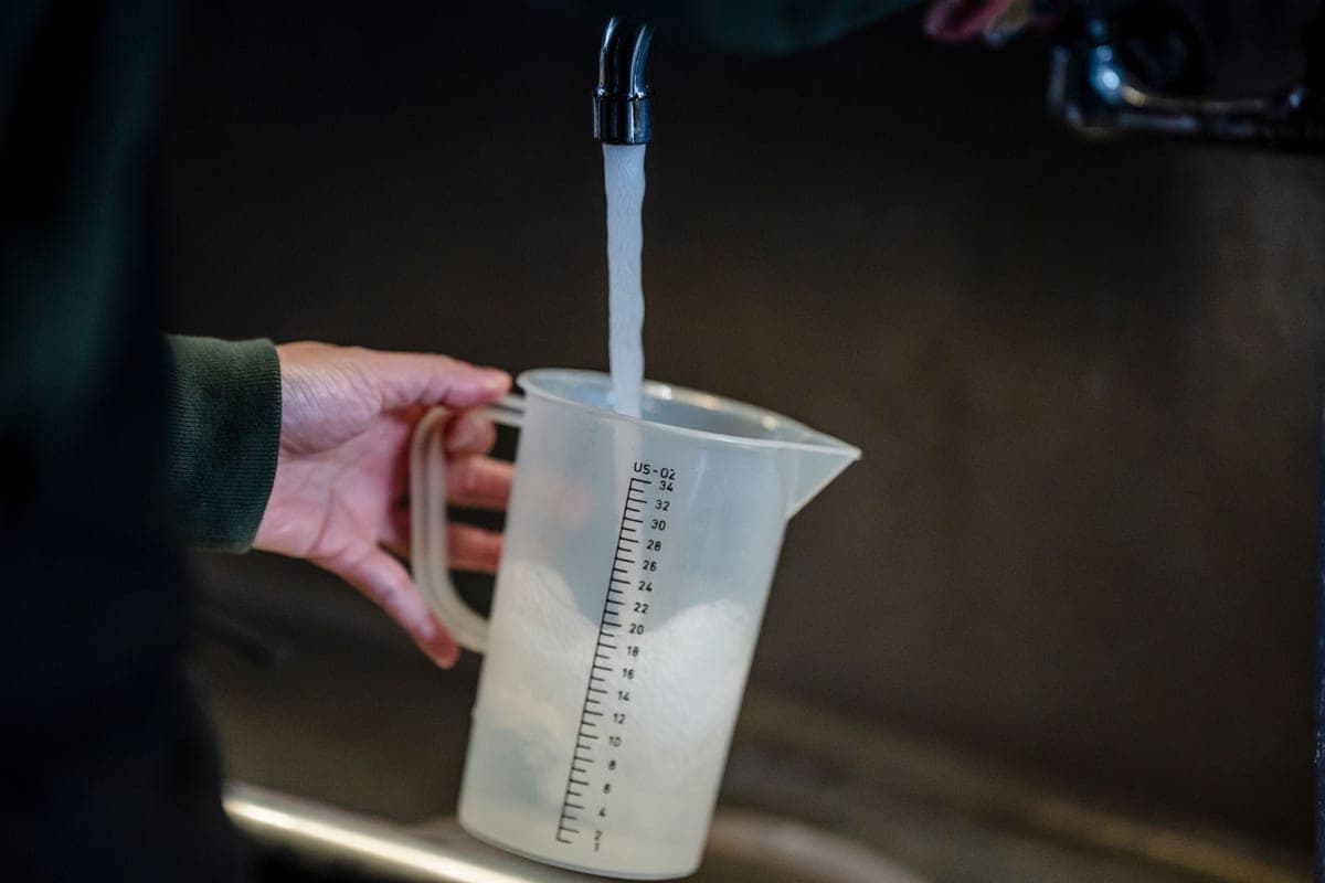 Clean water being poured, catching the light